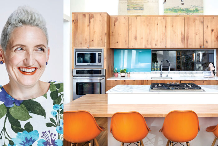 cgs woman smiling at beautifully remodeled kitchen
