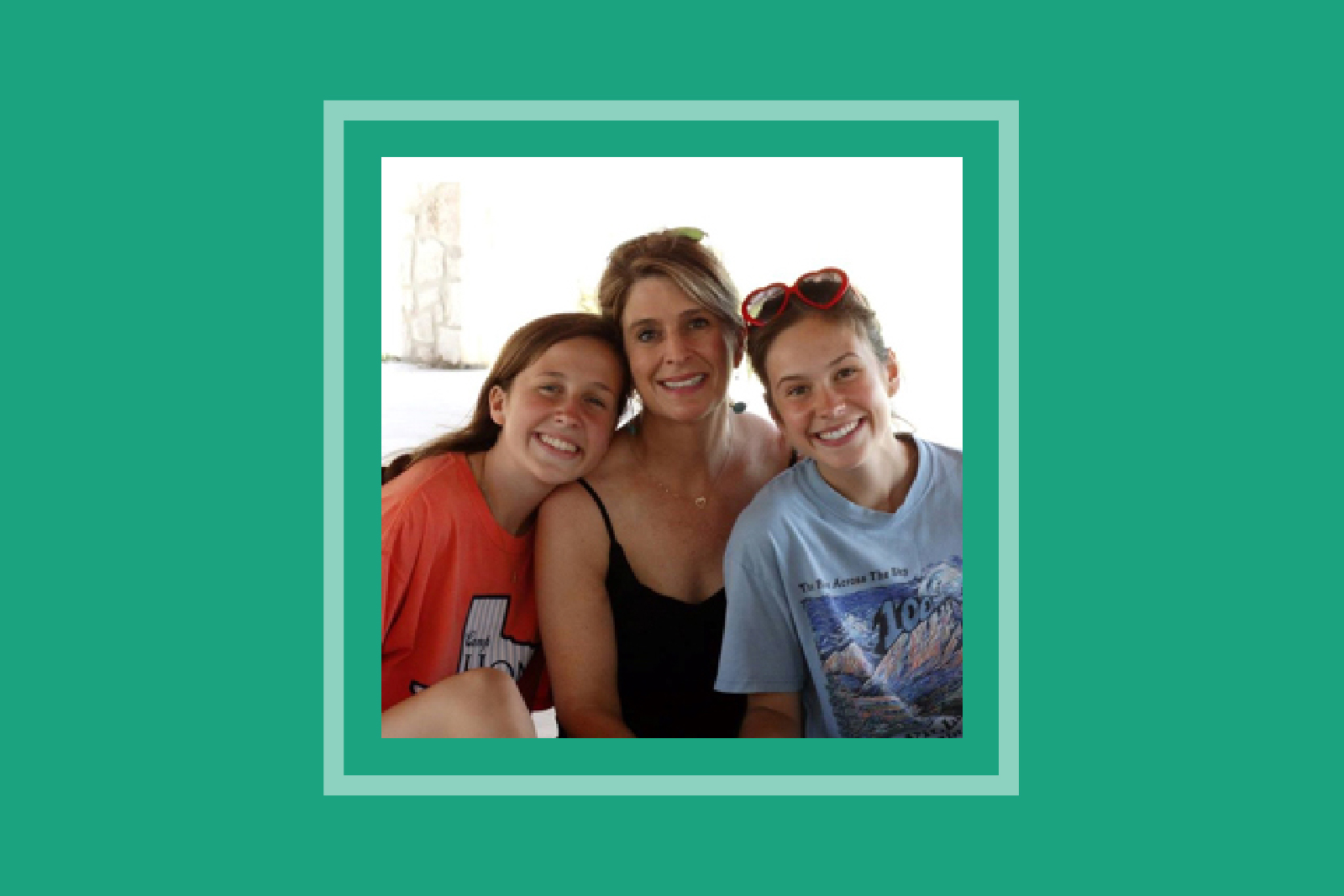 Headshot image of mother and two daughters on teal background